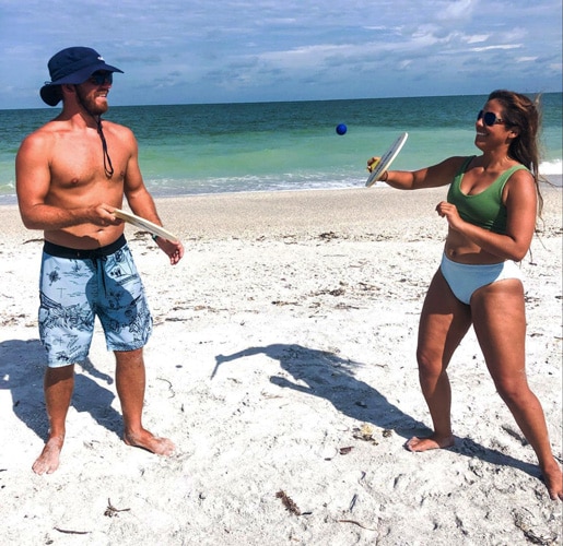 View of the author and his wife having fun by the beach