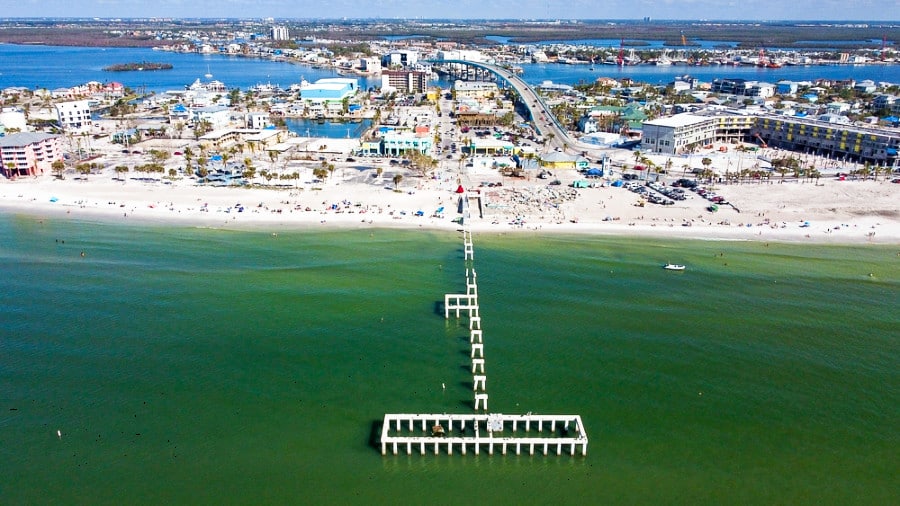 Aerial view of the long boardwalk at the Fort Myers Beach on a sunny day