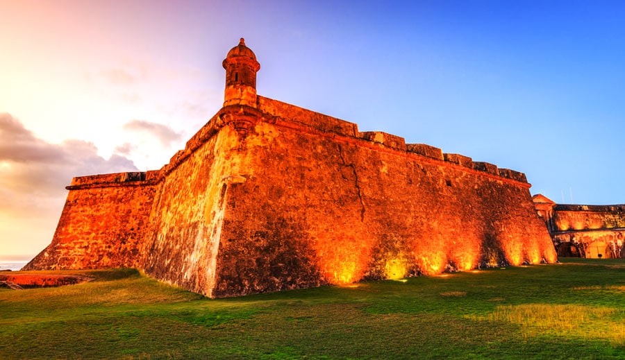 The Fort Sun Felipe del Morro and the colorful sky during sunset