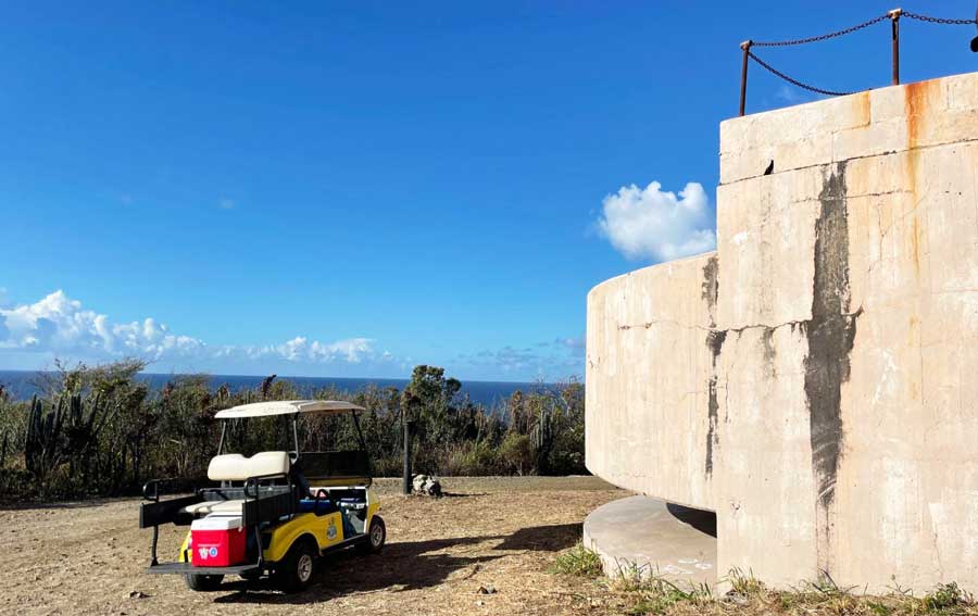 A golf cart in Fort Segarra and the clear blue sky over it