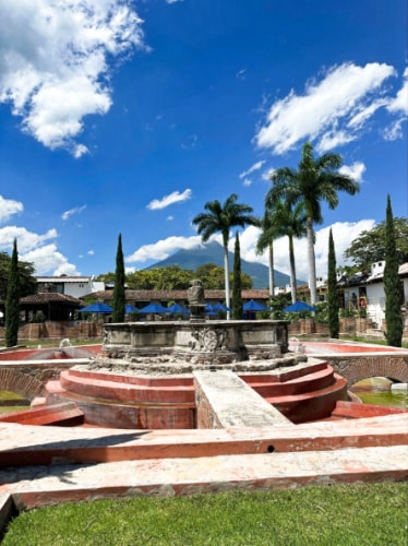 View of the fountain ruins with the volcano in the background