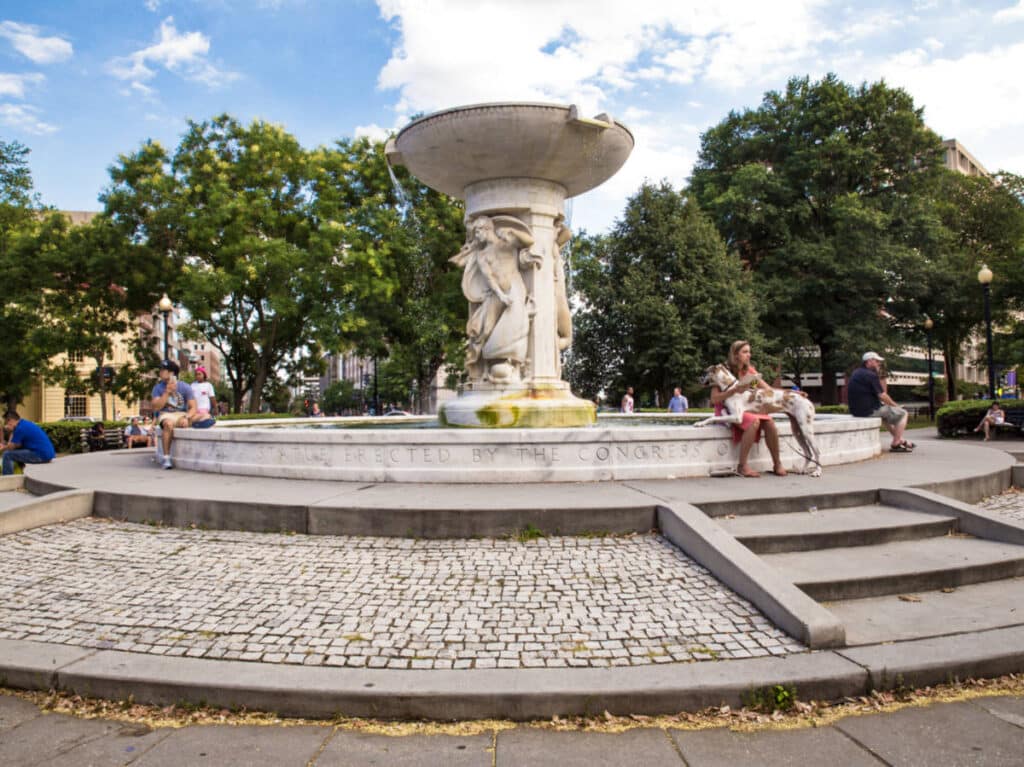 View of the people chilling around the fountain in Dupont Circle