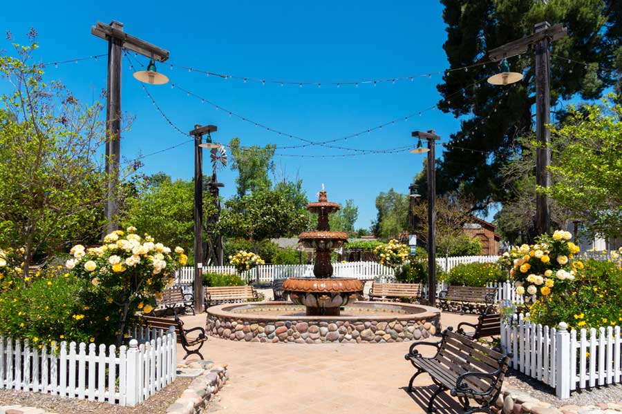 A water fountain at the middle of a garden in Old Poway Park