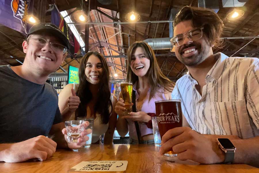 The author with her friends enjoying their beer from Four Peaks