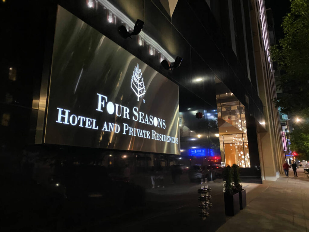 Exterior sign at the Four Seasons Denver at night
