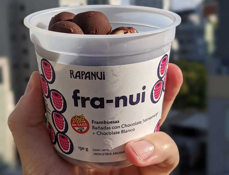 A hand holding a cup of Fra-nui
