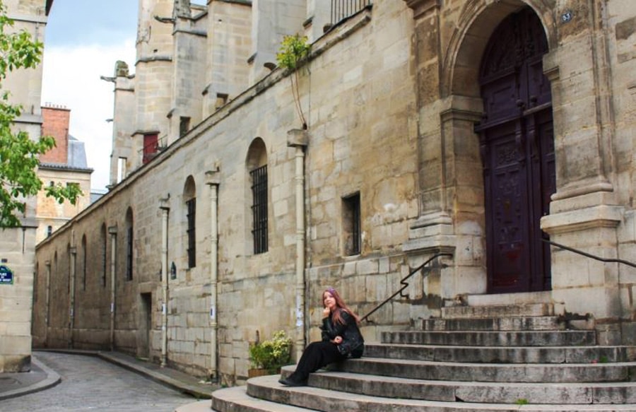 View of the author in front of a church in France