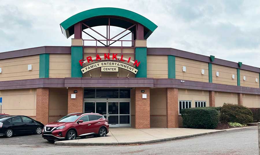 Cars parked in front of the Franklin Family Entertainment Center building