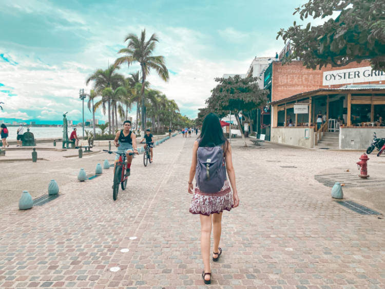 Clara walking along the Malecón on the Free Walking Tour Puerto Vallarta