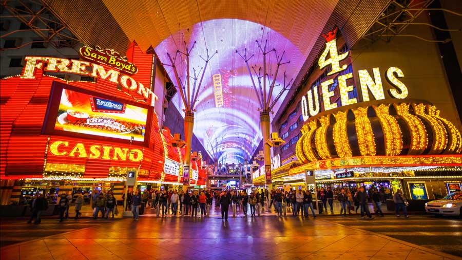 Neon lights and people wandering in Fremont Street Experience