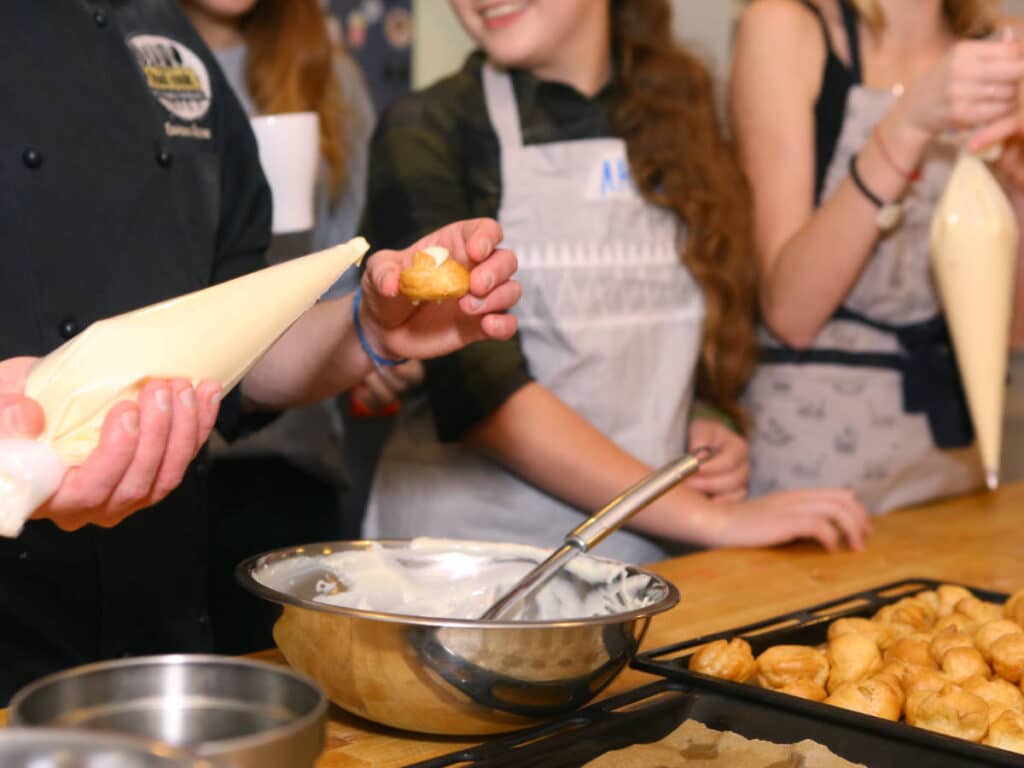 People enjoying their day during a French cooking class