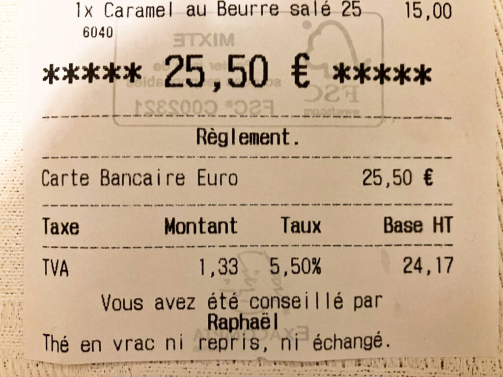 Closeup look of the tax inclusion on the receipt in France