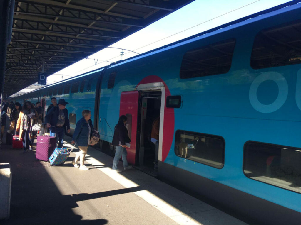 People going inside the French train