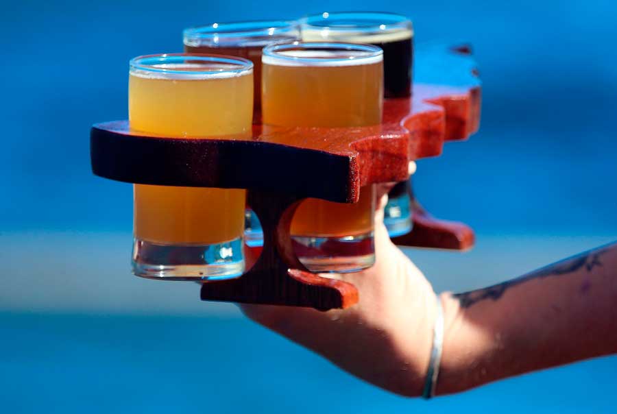 A man holding a beer flight in St. Thomas
