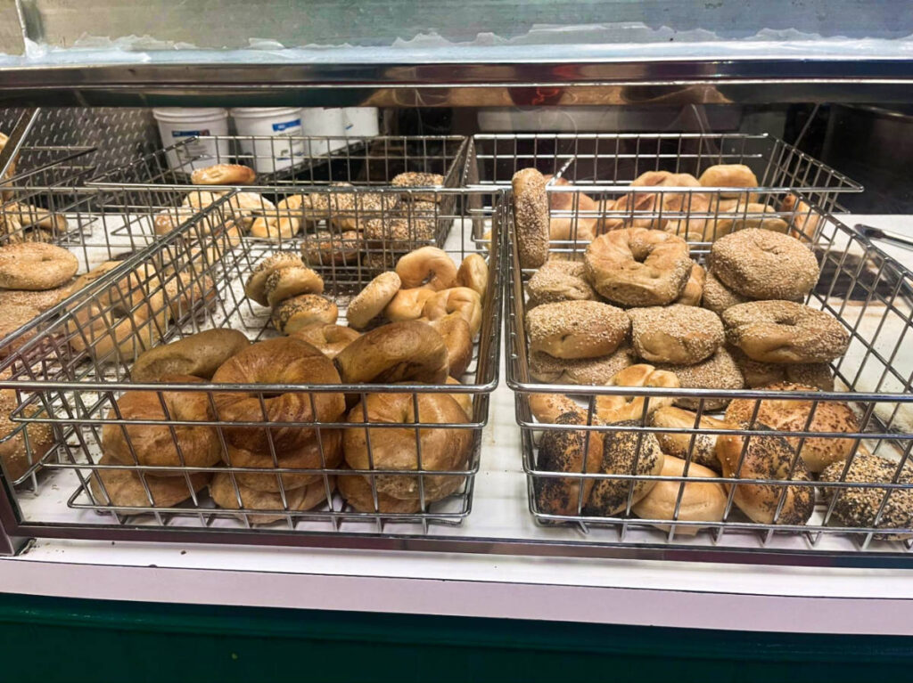 Freshly baked bagels on the cooling tray in Absolute Bagels