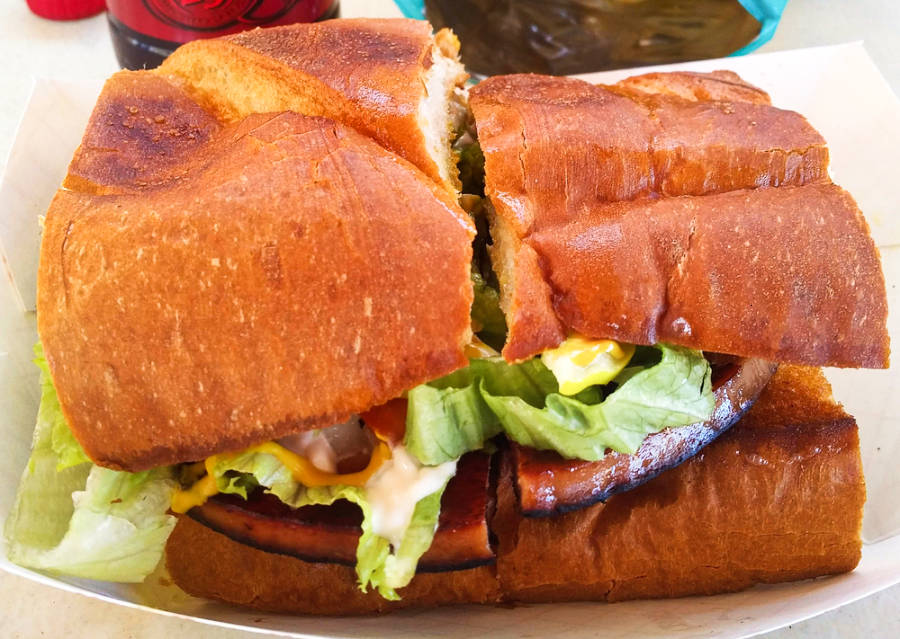 Closeup view of the fried bologna sandwich cut in half