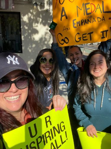 Friends with their signs supporting the runners at NYC Marathon
