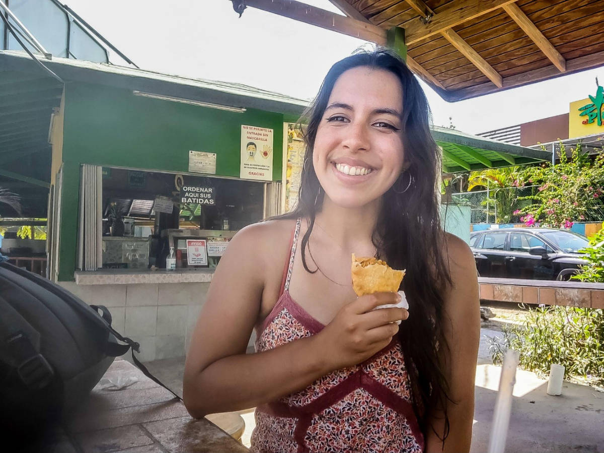 The author Vanessa Ramos eating fritters at Piñones