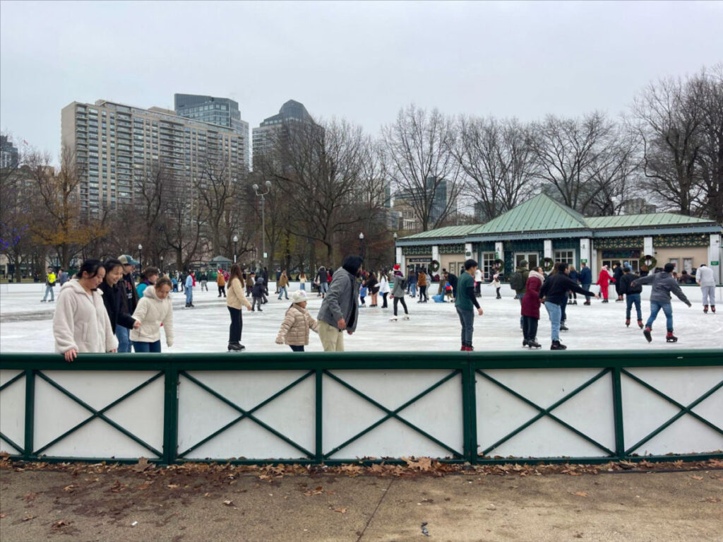 People skating at the Frog Pond Ice Skating Rink