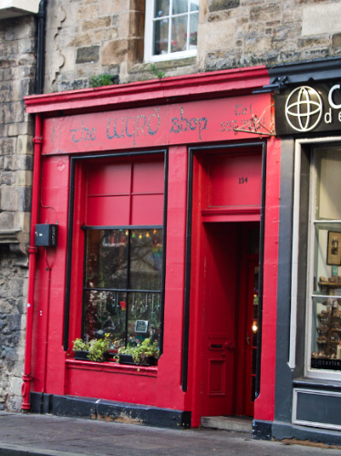 View of the red front door of the Wyrd Shop