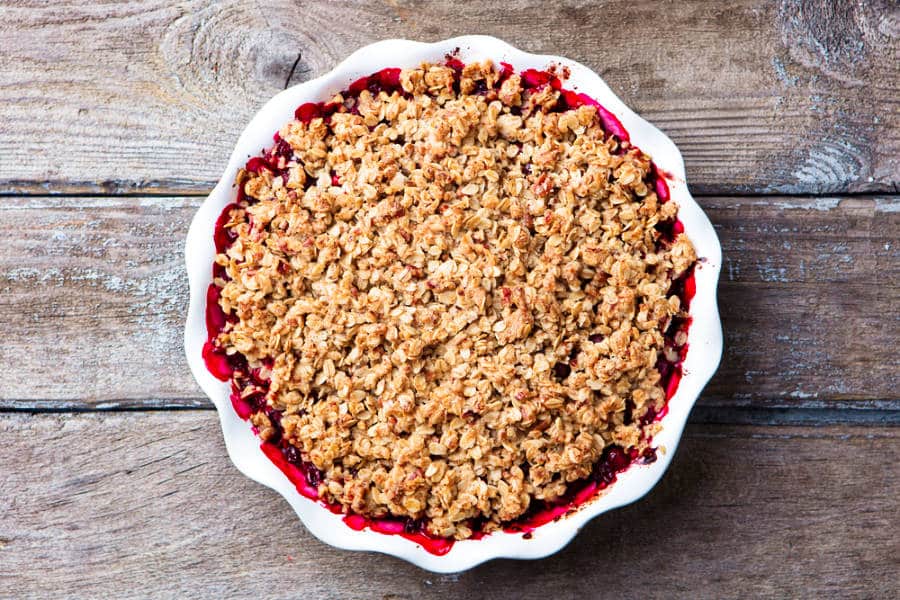 Berry crumble on a white baking dish