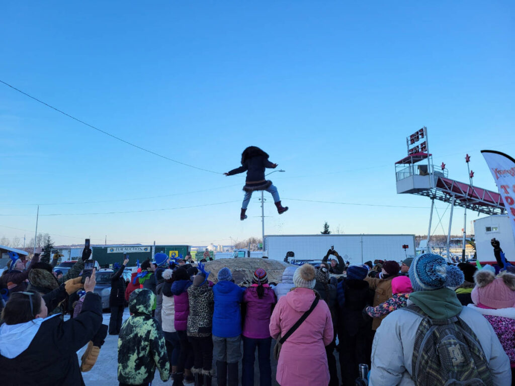 People during blanket toss at Fur Rendezvous