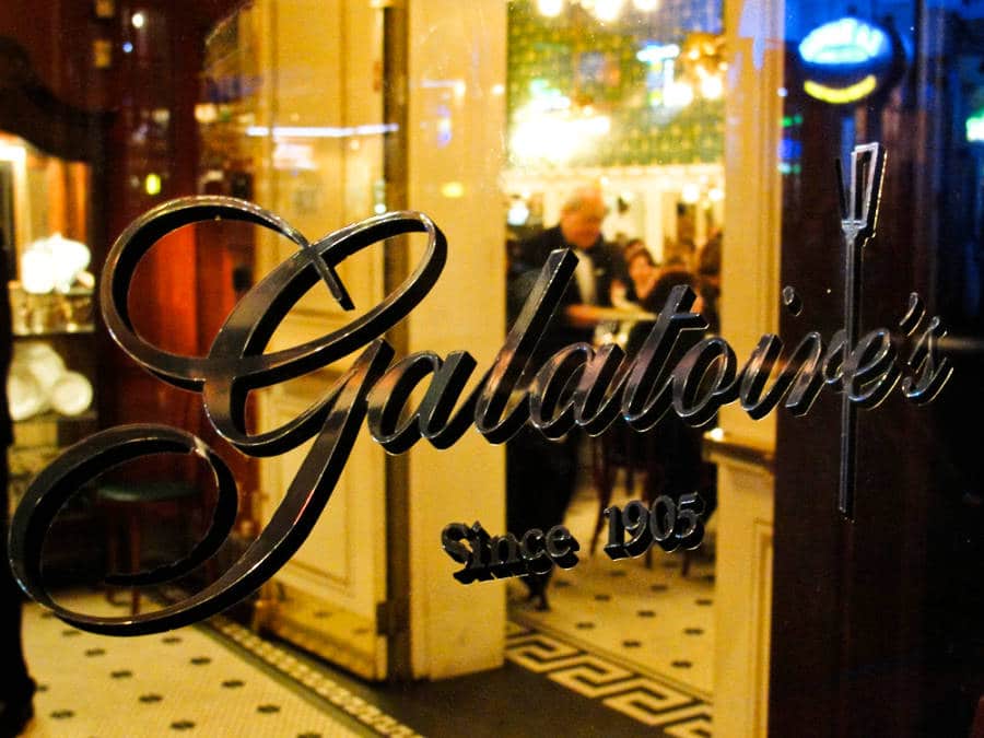 Galatoire’s logo at the restaurant's glass window