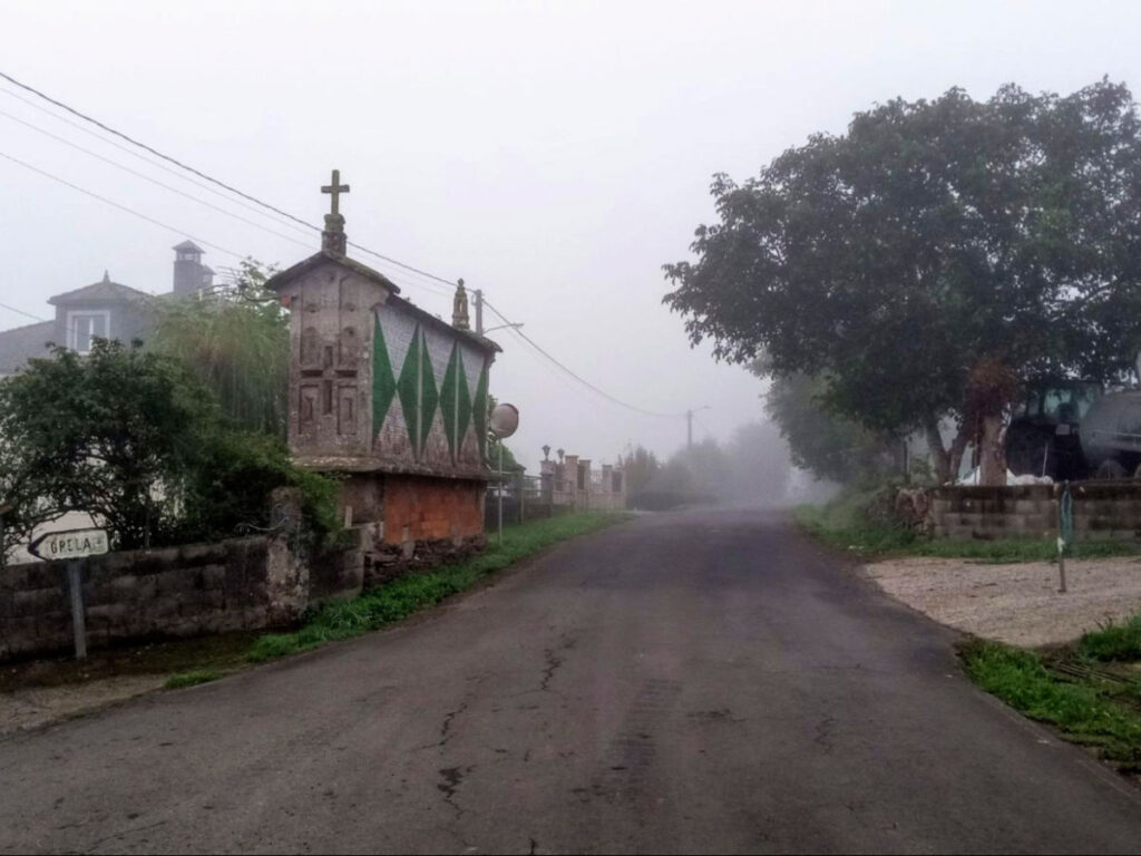 View of Galicia’s hórreos during the hike into Lugo on a foggy day