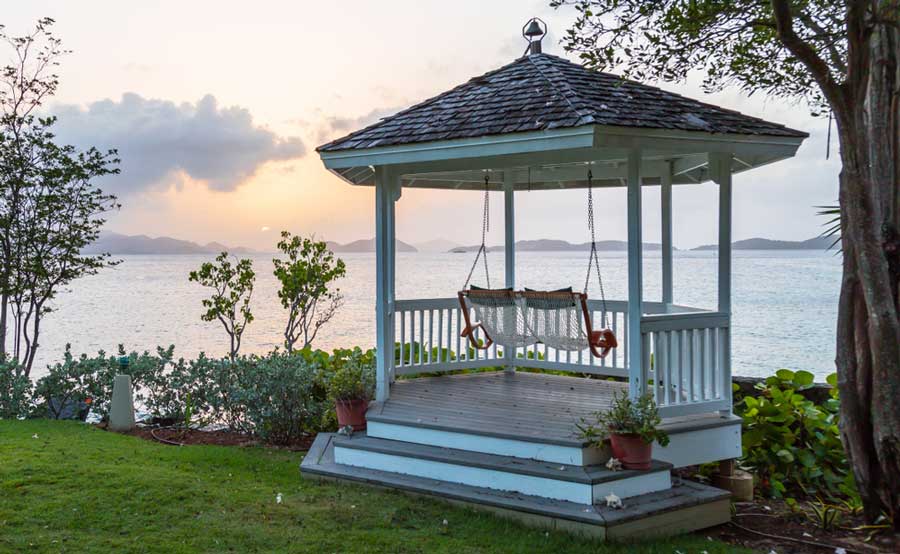 A swing in Gallows Point Resort with a view during sunset