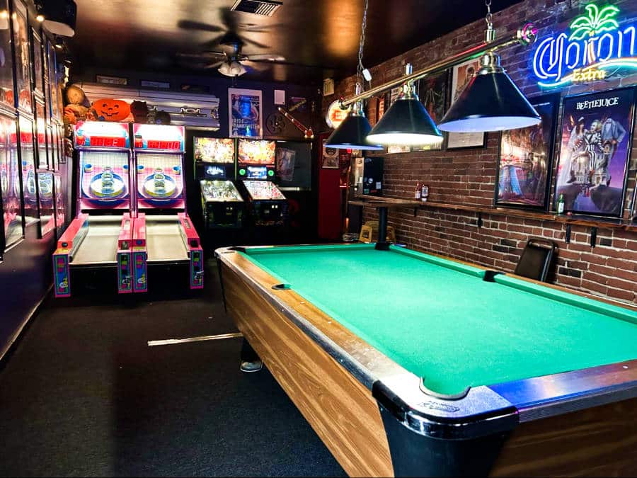 View of the billiard and arcade inside a bar in South Tacoma