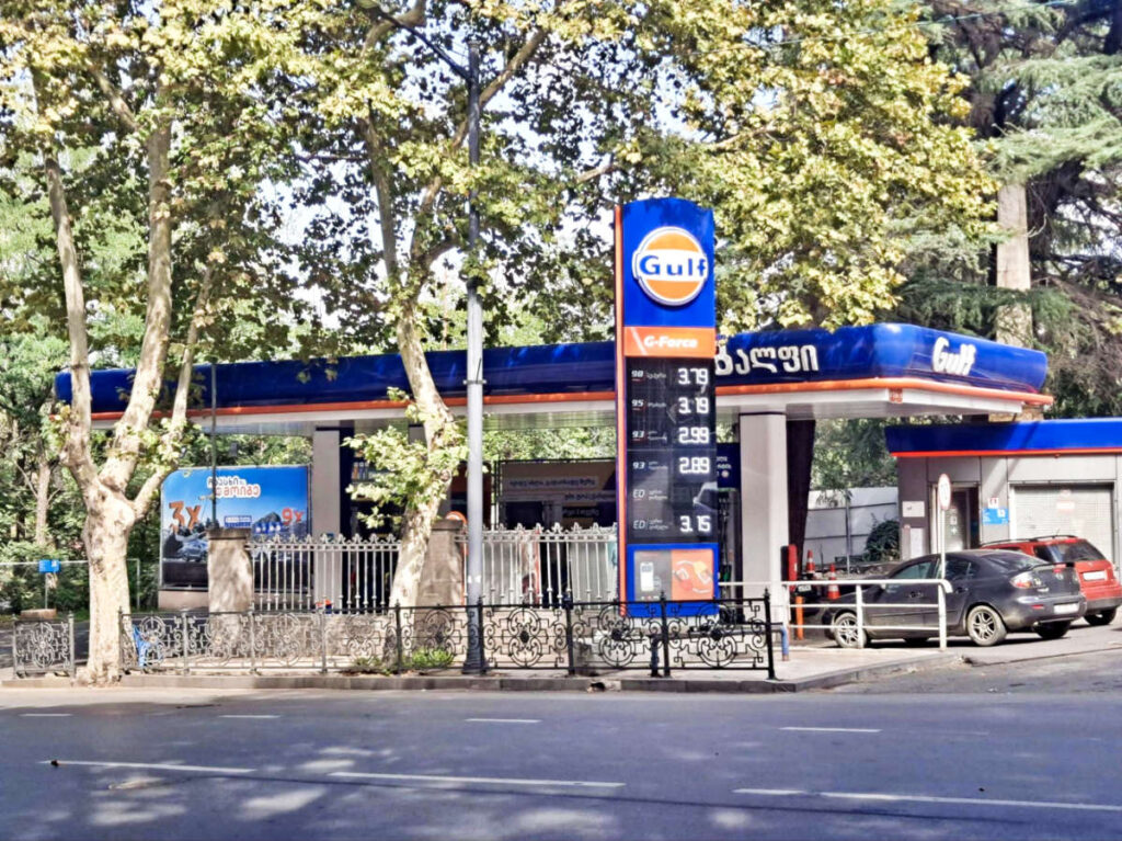 View of the signage with gas prices from across the street