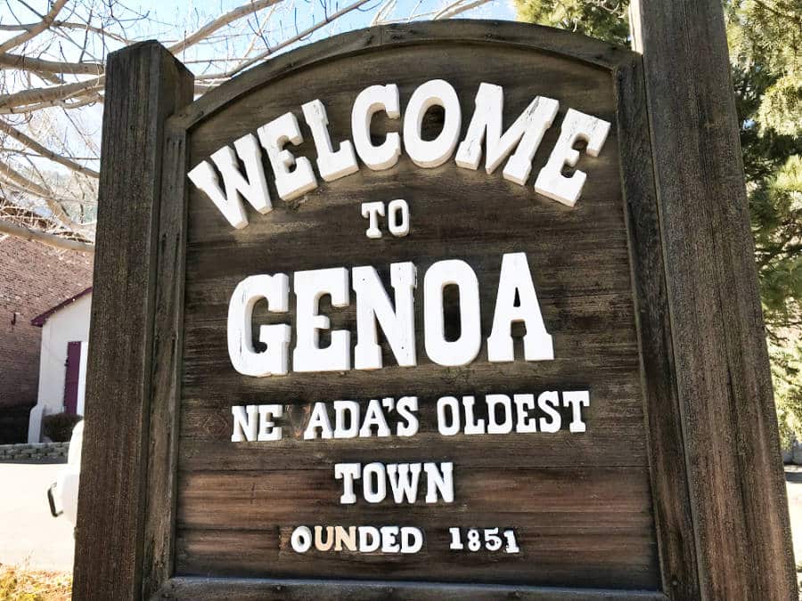 Wooden welcome signage of the town of Genoa
