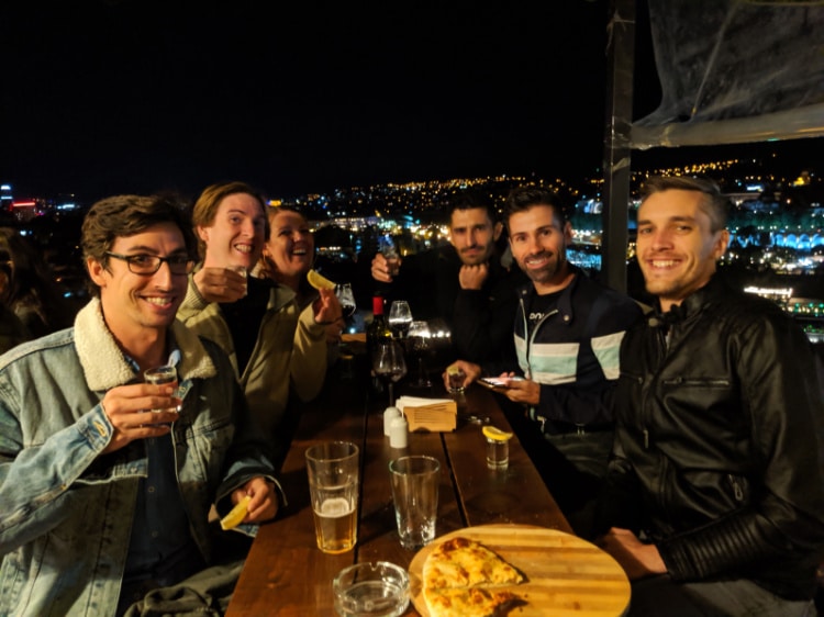 Nate with friends in Tbilisi at night