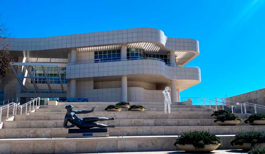 A staircase with sculpture going to the entrance of Getty Center