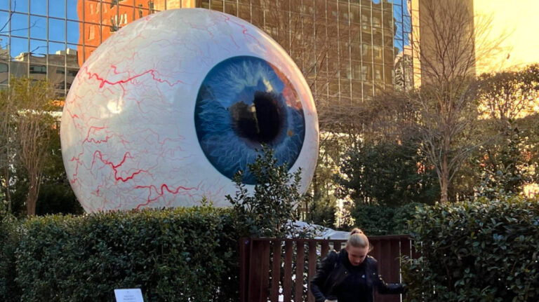 Author Sarah Heath in front of the Giant Eyeball Art Installation