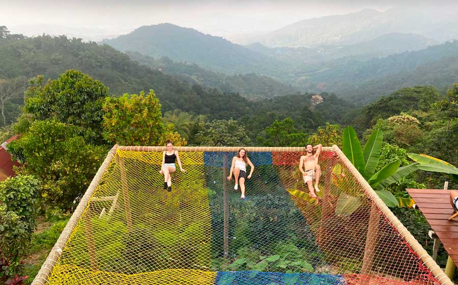 People laying on a giant hammock in Colombia