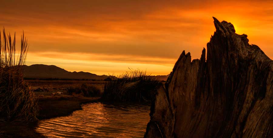 Orange sky over the Gila Hot Springs Vacation Center during sunset