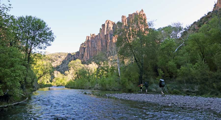 View of hikers during their hike passing by the Gila Hot Springs