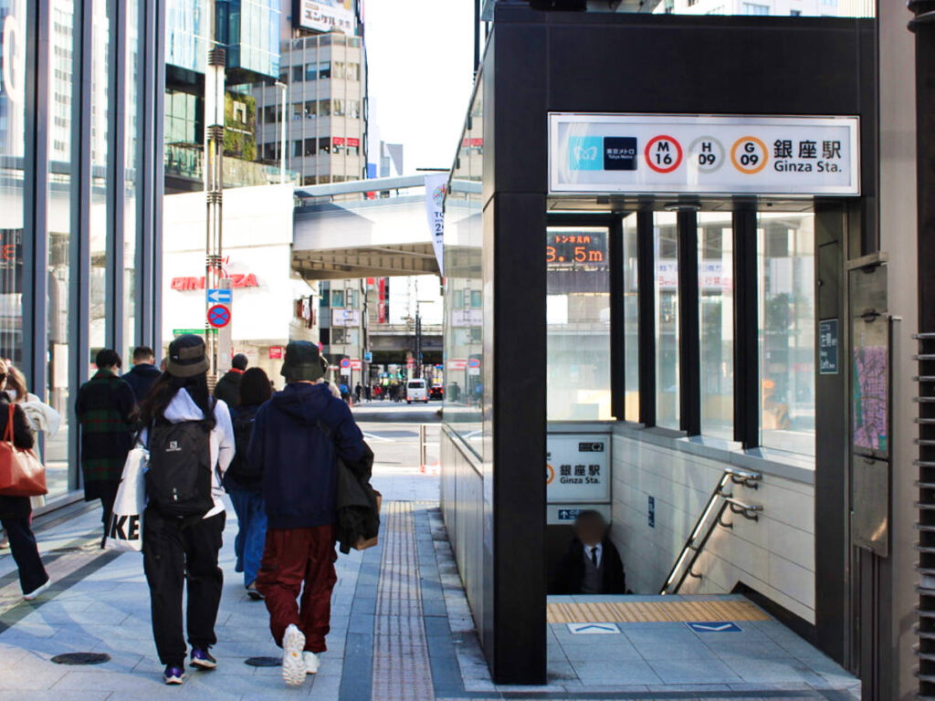 People walking near the entrance of Ginza Train Station