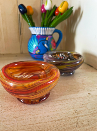 Two colorful bowls made of glass