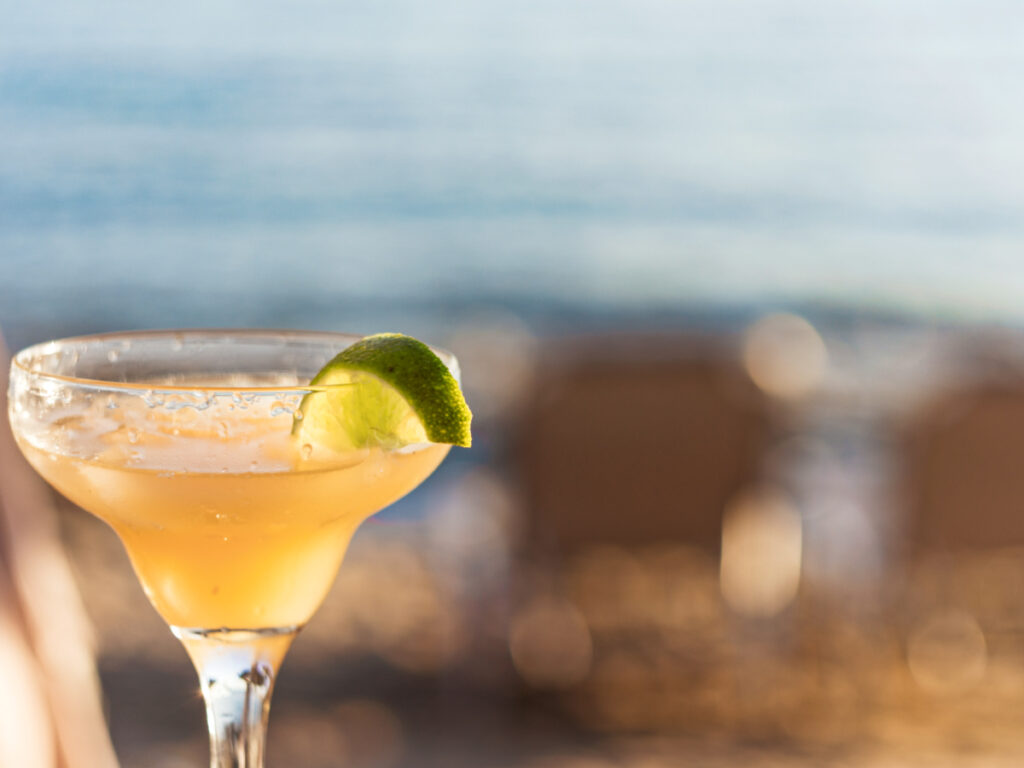A glass of margarita cocktails with lime and salt