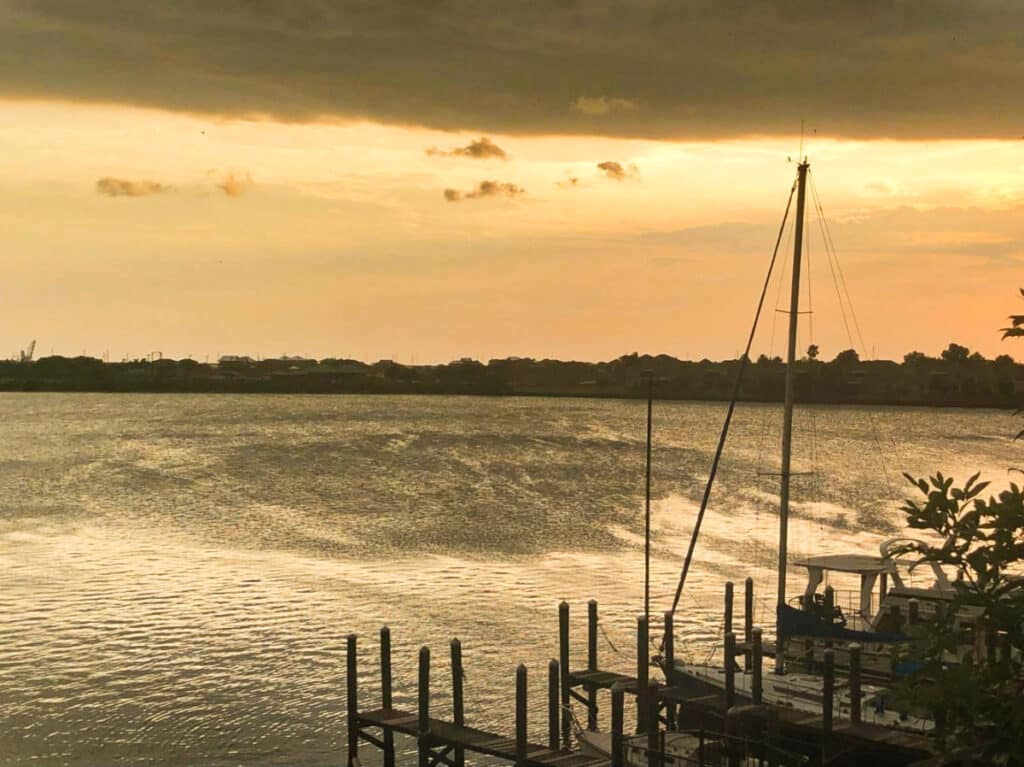 A big wave approaching the port on a gloomy afternoon