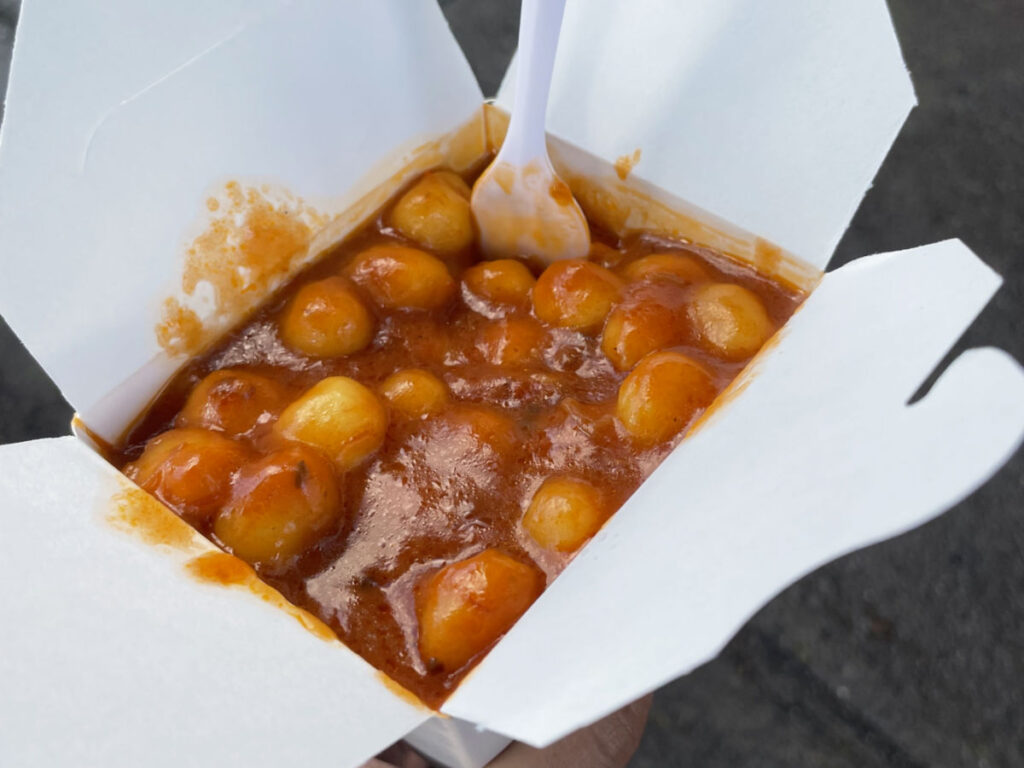 Gnocchi in tomato sauce in a take out container