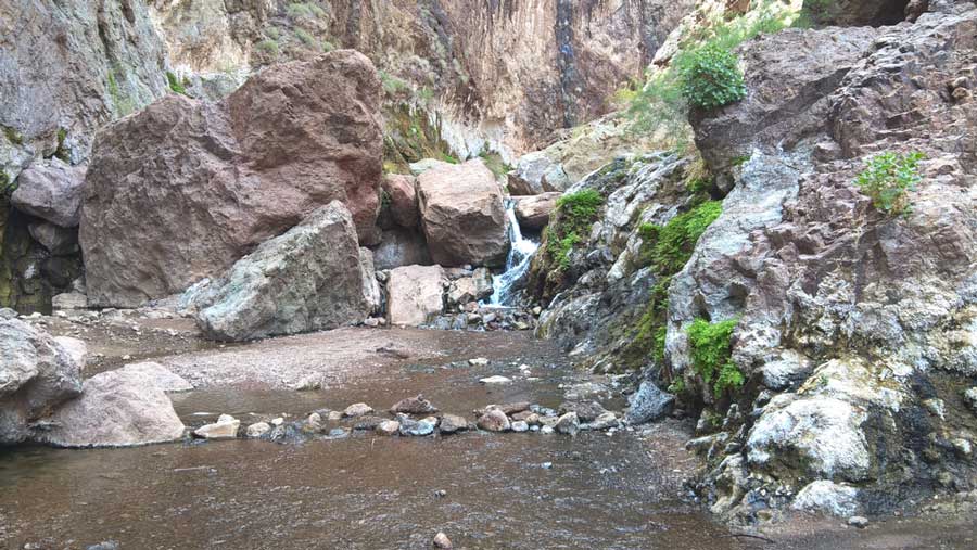 View of a waterfall while on a hike in Gold Strike Canyon Trail