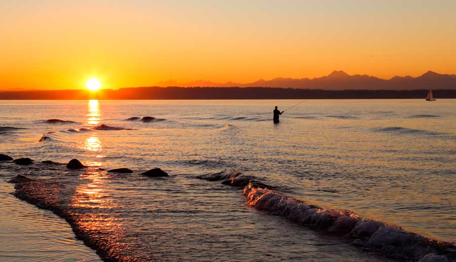 A fisherman fishing in Golden Gardens Park