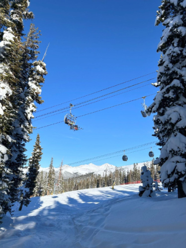 Clear blue sky over the gondolas and lifts at the Keystone Ski Resort