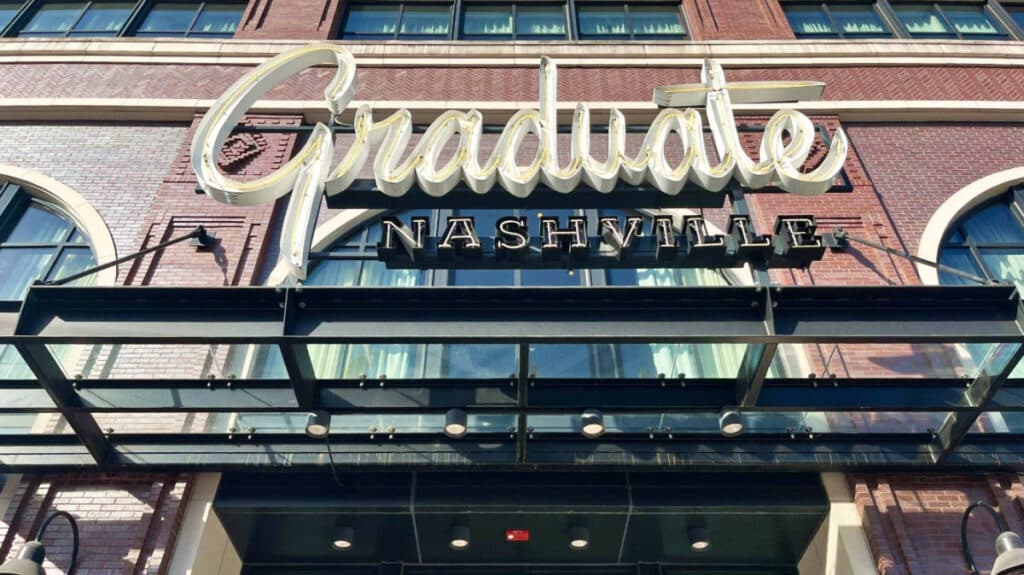 Exterior view of the Graduate Nashville with the neon sign near the entrance