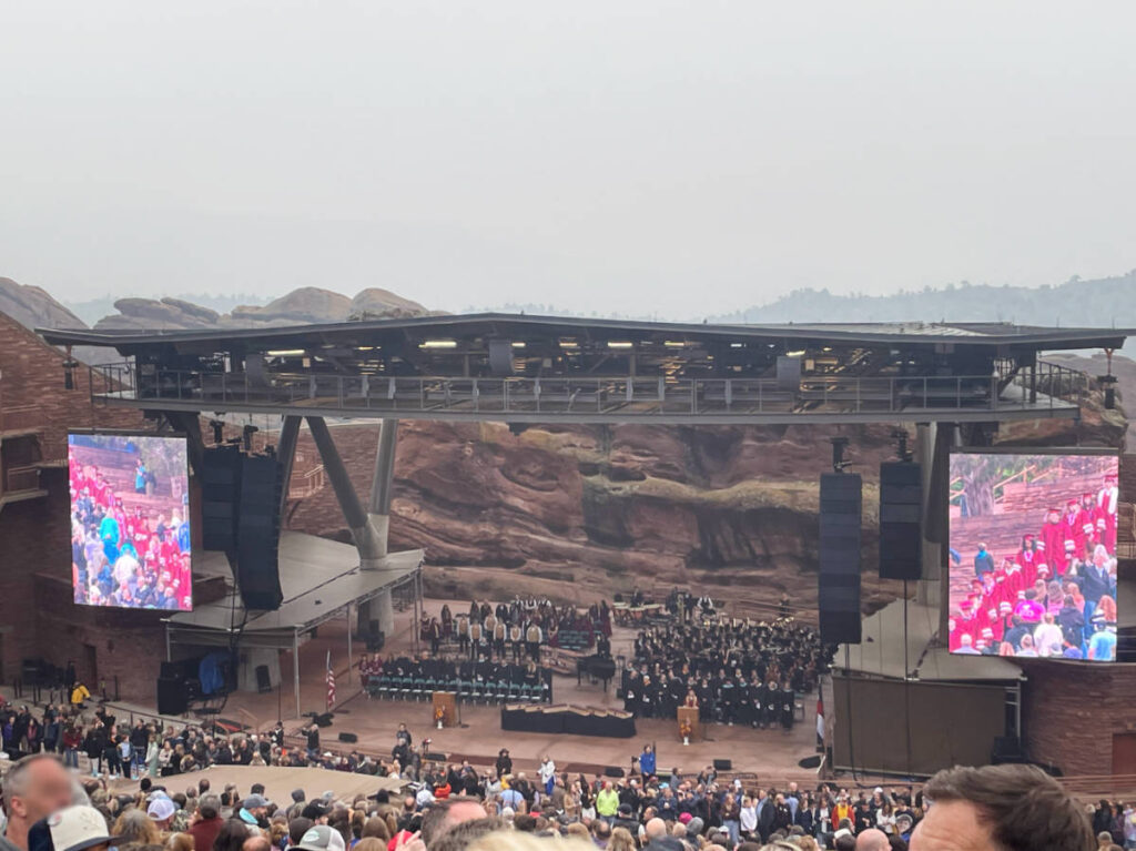 View of the author during a graduation ceremony at the Red Rocks Amphitheater