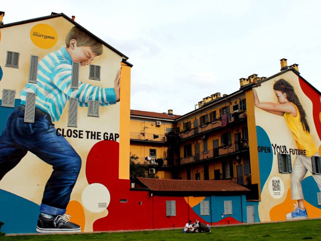 View of the colorful mural on the building in Isola neighborhood of Milan