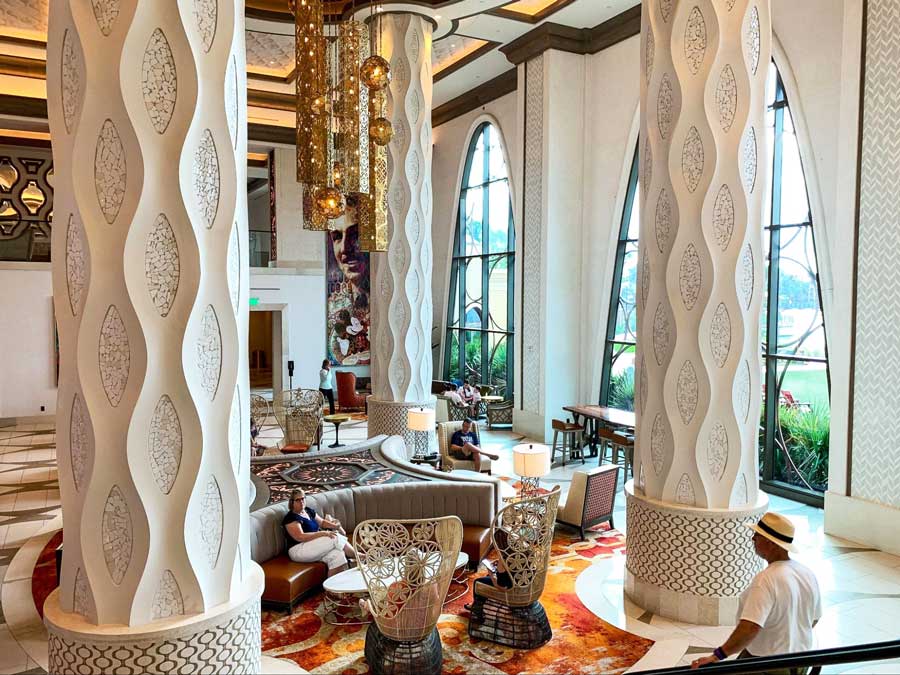 People at the sitting area inside the Gran Destino Tower at Disney’s Coronado Springs Resort